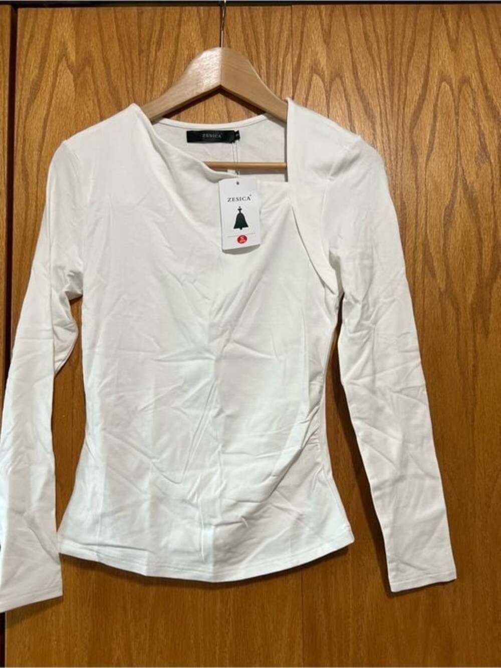 Zelica Women's White Long-Sleeve Tee asymmetrical neckline